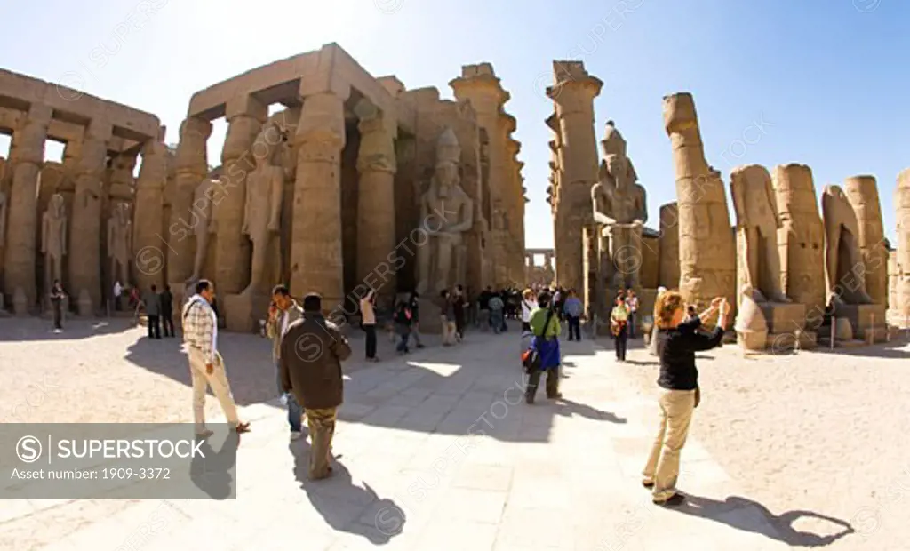 Luxor Temple courtyard with colonnade and large statues of Ramses II Egypt North Africa