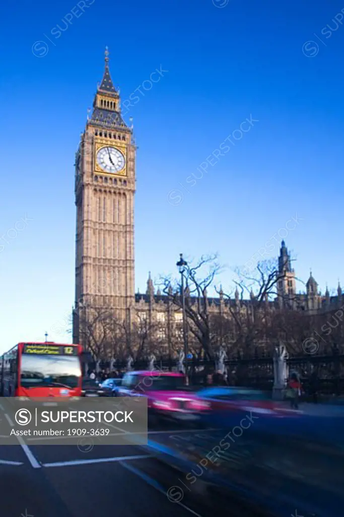 Big Ben clock clocktower red bus and taxi Parliament Square in evening sun sunshine in spring winter London England GB Great Britain UK United Kingdom British Isles Europe EU