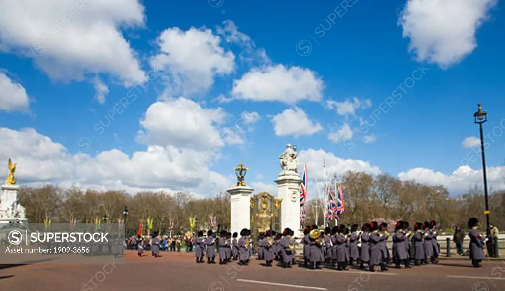 The Coldstream Guards Regiment with regimental band  playing music and marching at the Changing of The Guard ceremony at Buckingham Palace London England Great Britain GB United Kingdom UK British Isles Europe EU