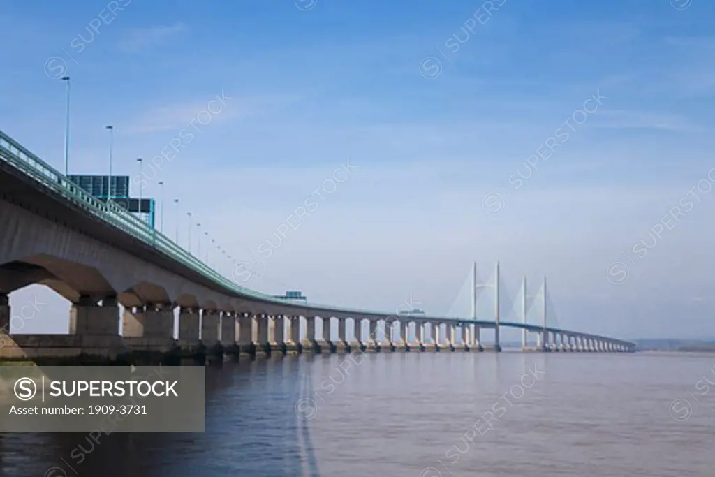 New Severn Bridge across the River Severn estuary that divides England from Wales on sunny spring day with blue sky Gloucester Gloucestershire Glos UK United Kingdom GB Great Britain Europe EU