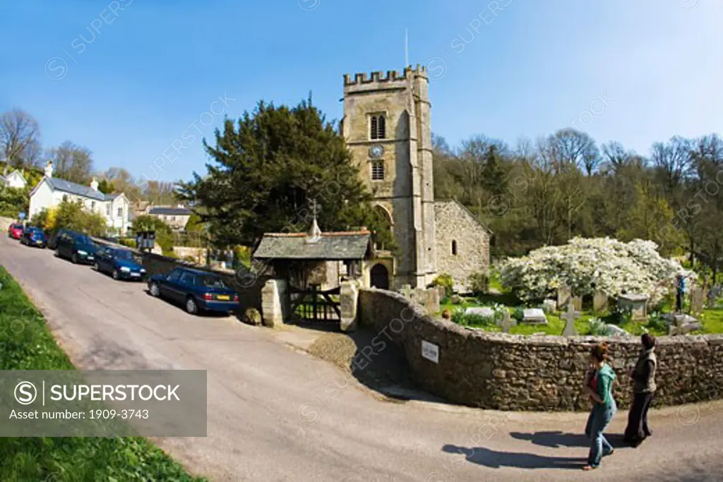 English village parish church and graveyard Salcombe Regis Devon in spring with cherry blossom England UK United Kingdom GB Great Britain British Isles