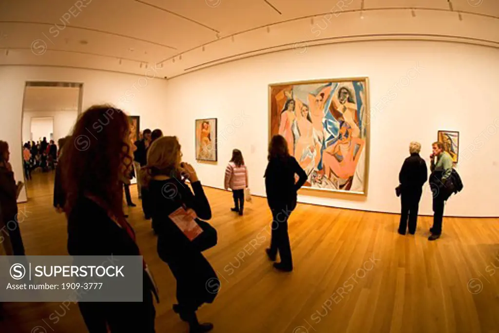 MOMA Museum of Modern Art interior with visitors admiring the painting Desmoiselles DAvignon of Avignon by Pablo Picasso fisheye lens midtown Manhattan New York City NY NYC USA United States of America North