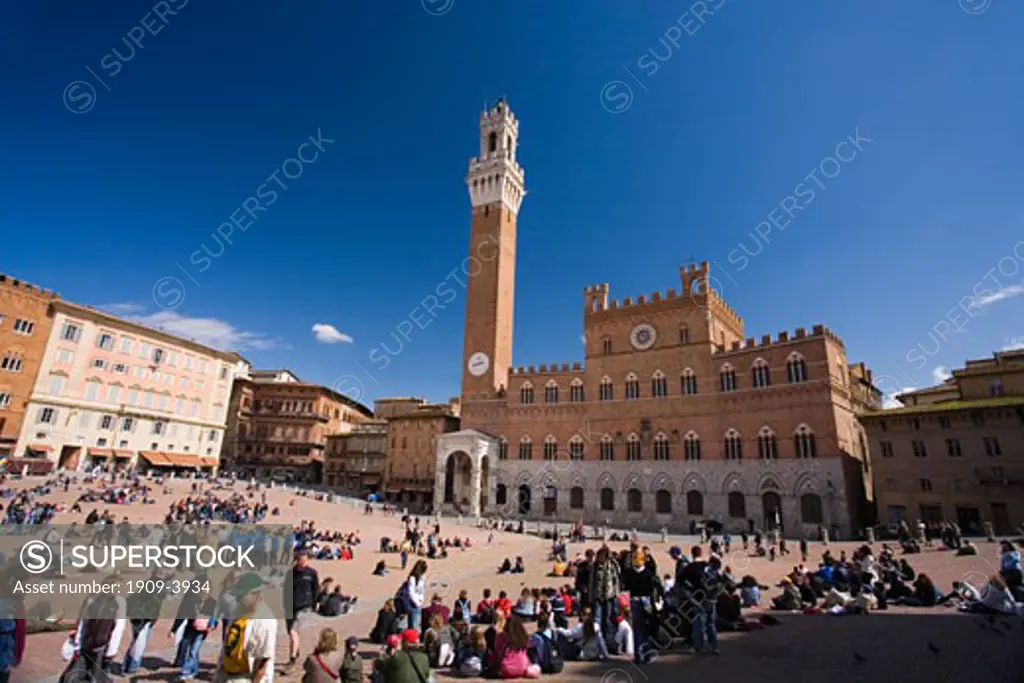 Siena Sienna Piazza del Campo 13th century city square showing Palazzo Pubblico and Torre del Mangia wideangle panoramic view Tuscany