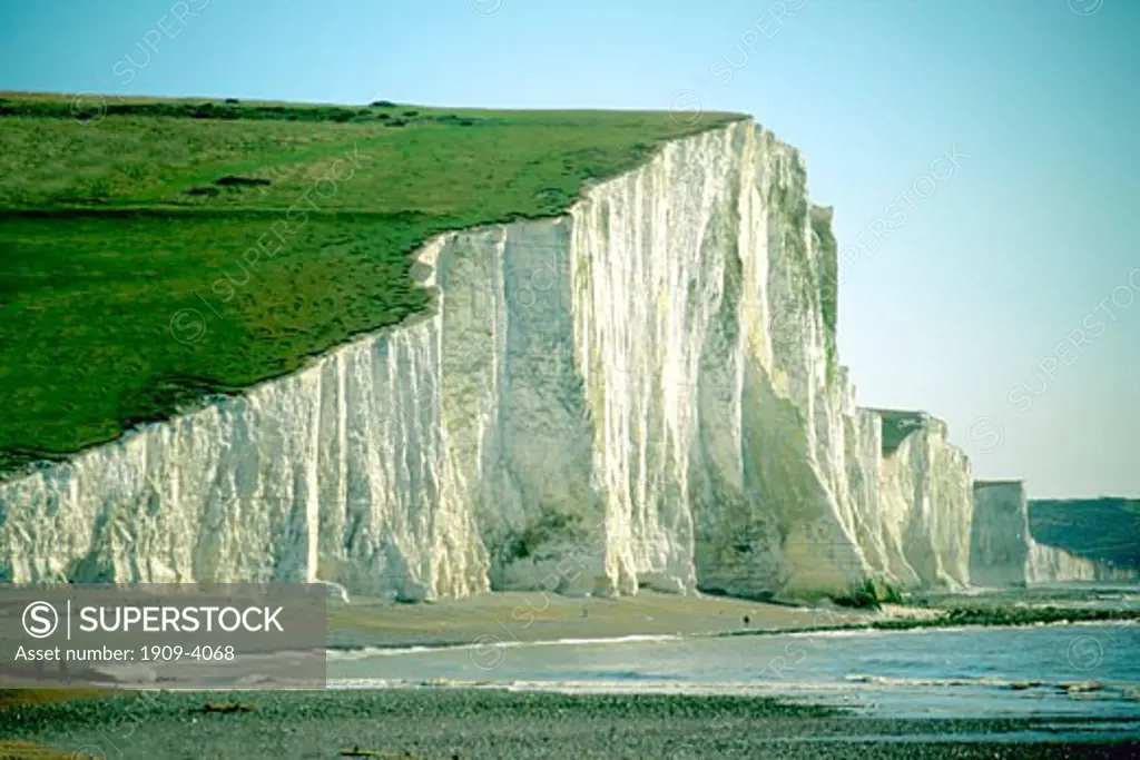 Towering white chalk cliffs of the Seven Sisters defend England against the English Channel Cuckmere Haven beach Sussex England Great Britain GB United Kingdom UK British Isles Europe EU This image replaces ABA309