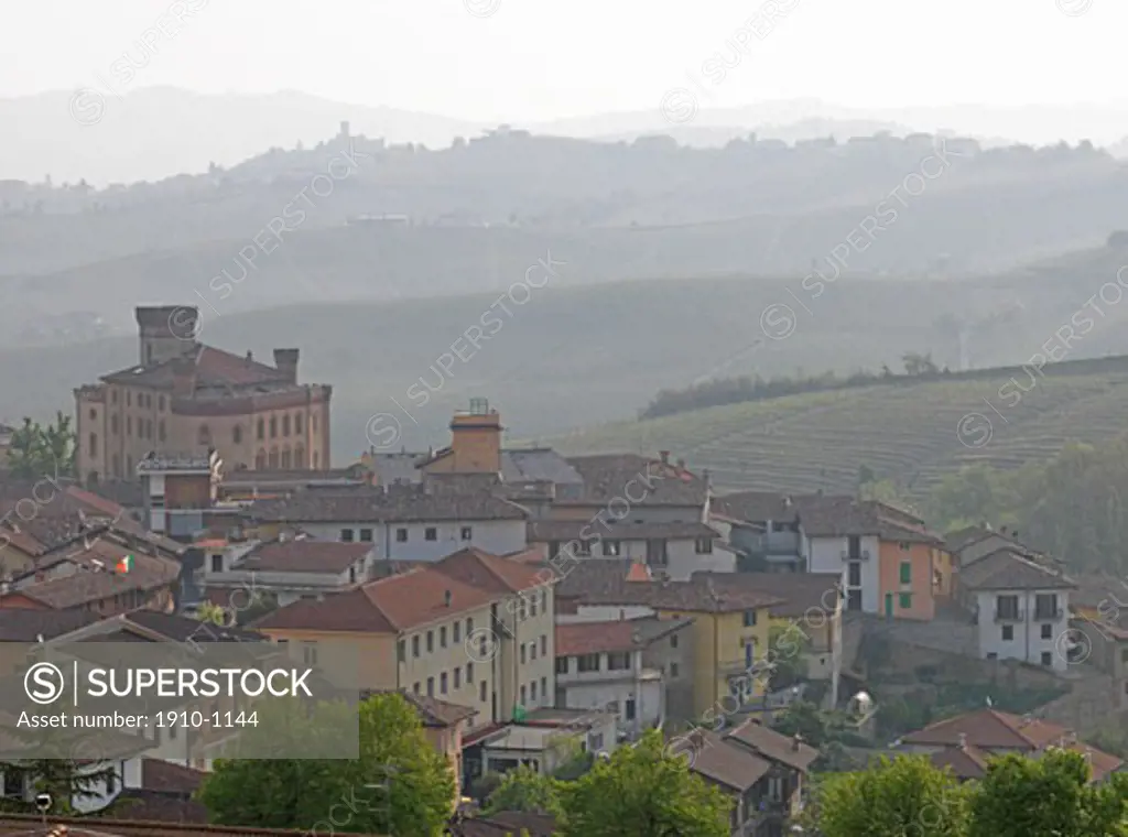 Barolo castle and townsite  with layers on vineyard carpeted hills behind  Italy  Piedmont