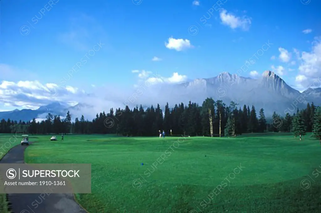 Canmore Golf Course and Three Sisters Mountain behind CANADA Alberta
