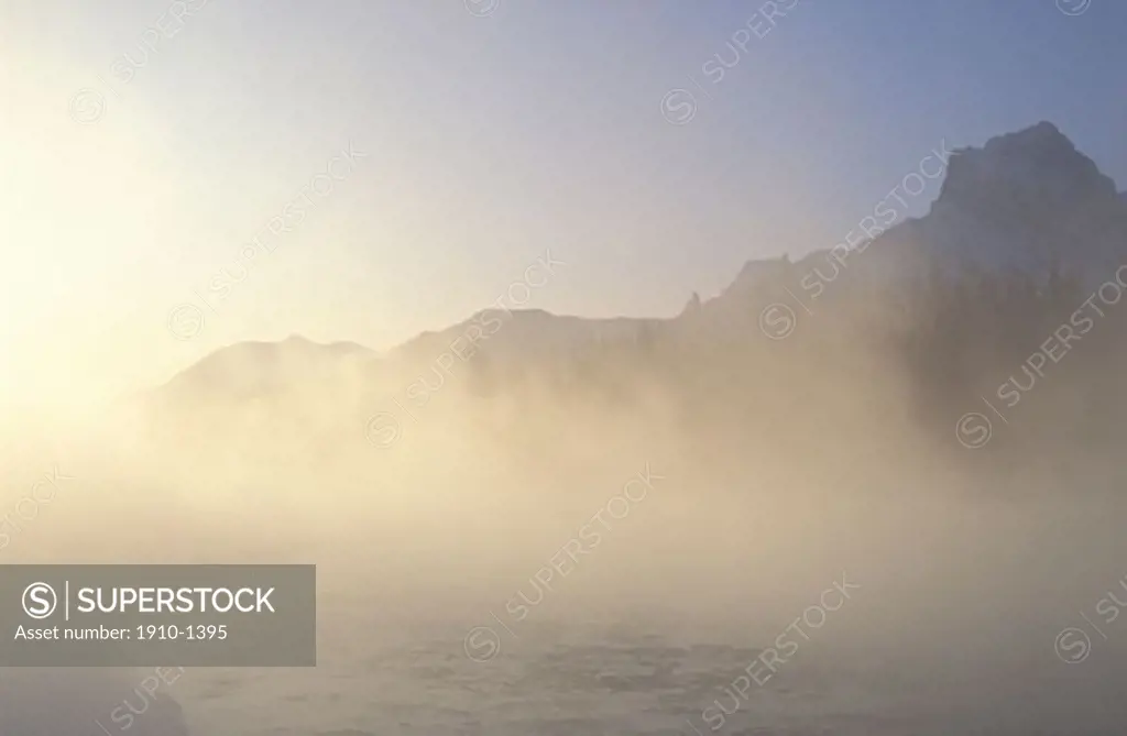 Steam rising from Bow River on very cold morning -40 degrees Canmore CANADA Alberta