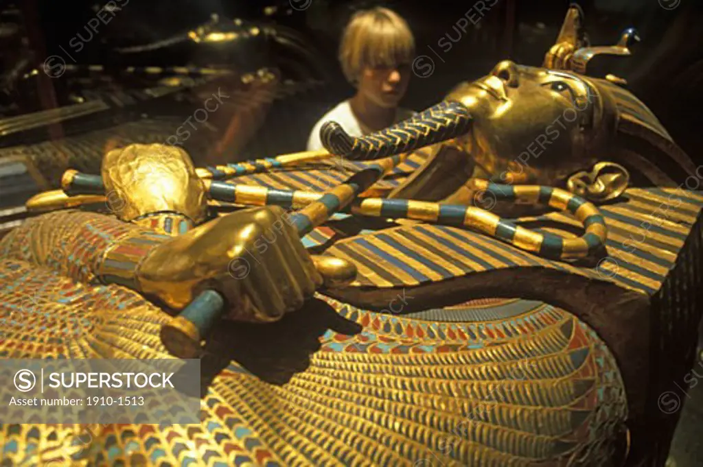 Boy 8 yrs looking at tomb of Tutankhamun at th Egyptian Museum Cairo Today Tutankhamun is the most famous Egyptian pharaoh The boy king died in his late teens and remained at rest for over 3300years EGYPT Cairo