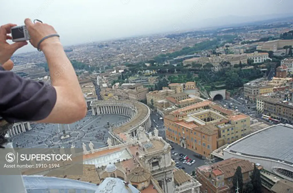 Man taking picture from St Peters Basilica towards Vatican Square and Rome The St Peters Basilica was dedicated by pope Urban VIII in 1626 Ever since this church has been the center of Christianity ITALY Lazio Rome