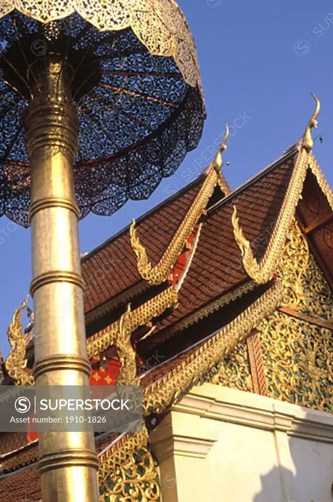 Richly decorated temple exterior with flying buttresses evident THAILAND Chang Mai