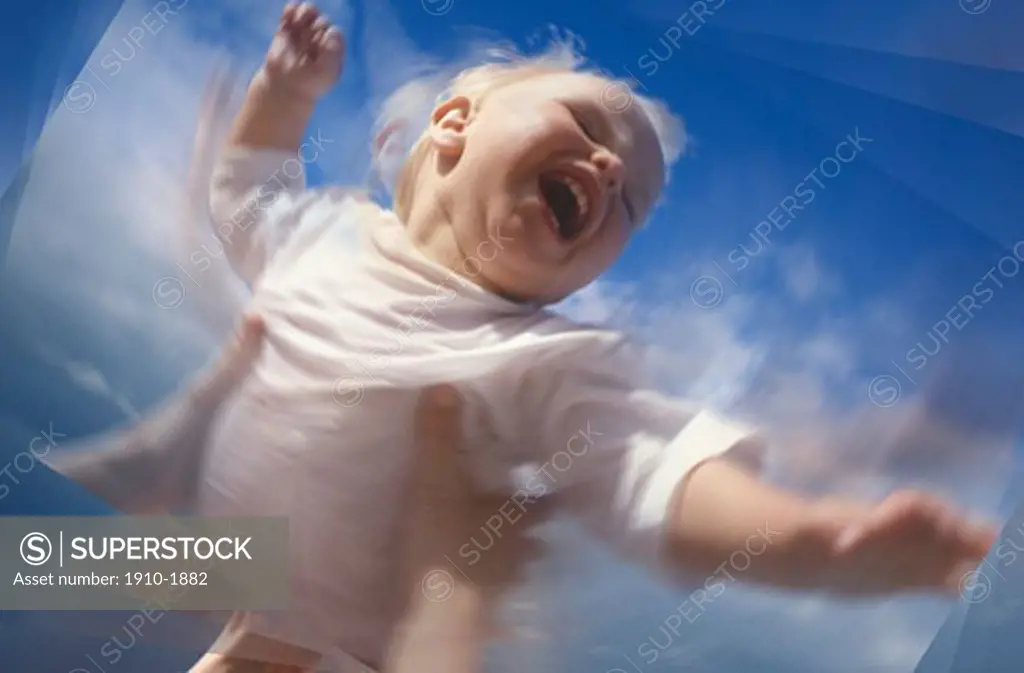 Digital composite view of young boy 2 being thrown into air by parent USA Utah