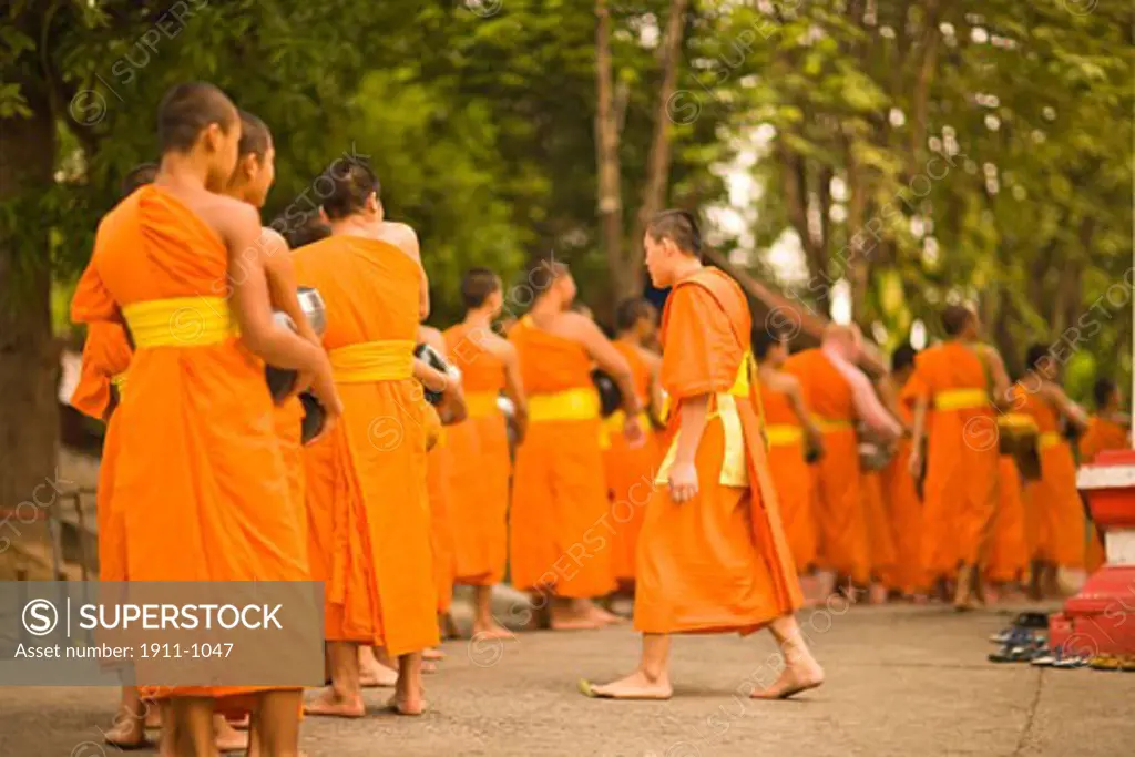 Buddhist Monks collecting food and special Sonkran Blessing  Wat Srisoda  Buddist Temple and Monastery  Chiang Mai  Thailand  SE Asia
