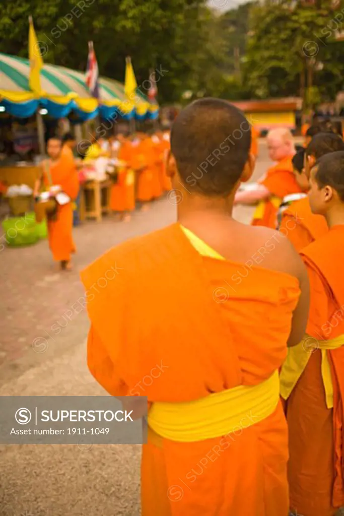 Buddhist Monks collecting food and special Sonkran Blessing  Wat Srisoda  Buddist Temple and Monastery  Chiang Mai  Thailand  SE Asia