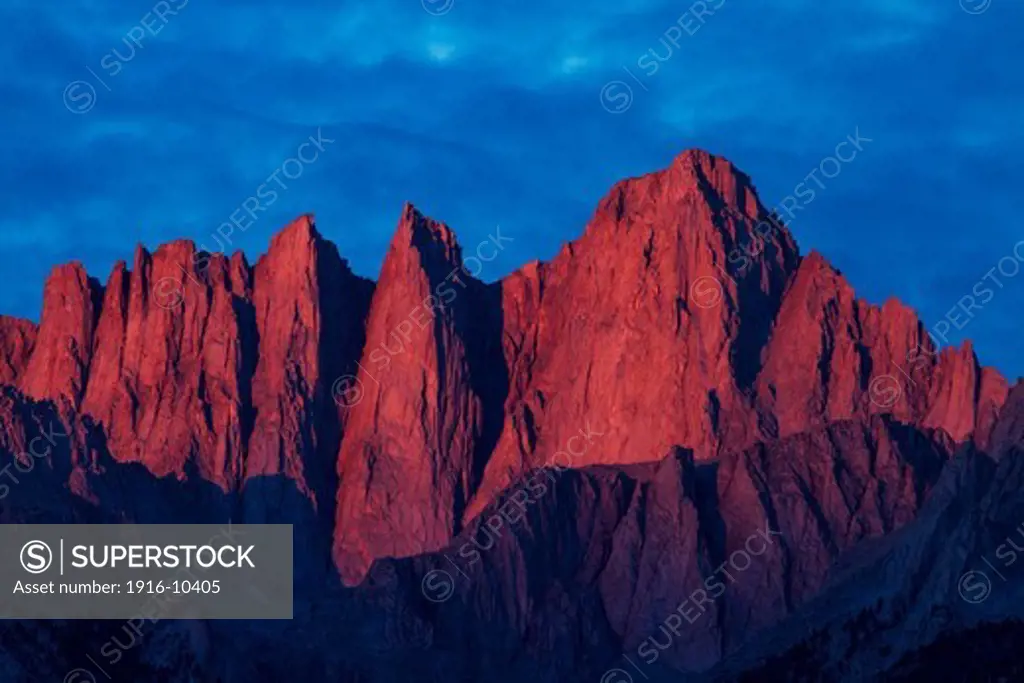 Mount Whitney, part of the Sierra Nevada mountain range in the early morning sunlight. Tripod.