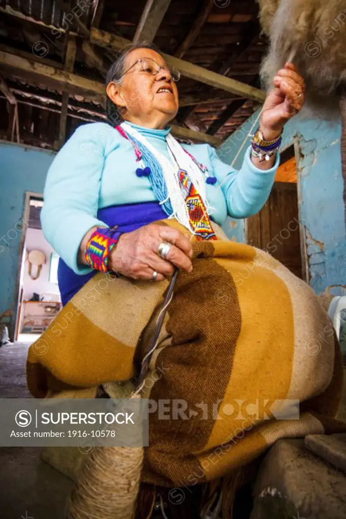 Mama Pastora, senior craftswoman Indigenous Kamentsa, spinning sheep's wool.  Ethnicity Kamentsa, Sibundoy, Colombia.