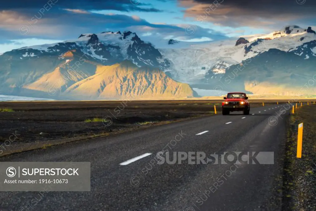 4WD vehicle crossing a mountain landscape in south Iceland.