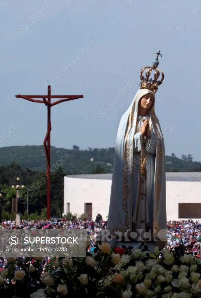 The statue of Our Lady of Fatima is carried by believers during the procession  of Fatima in central Portugal.
