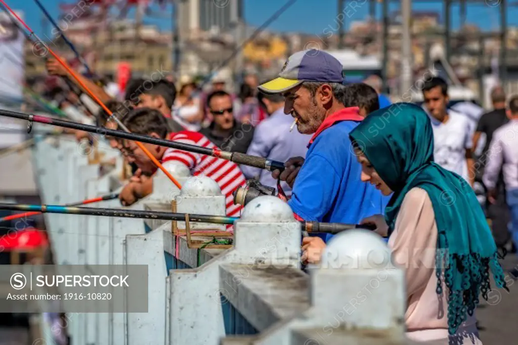 Fishermen at the Galata Bridge in Istanbul, Turkey.