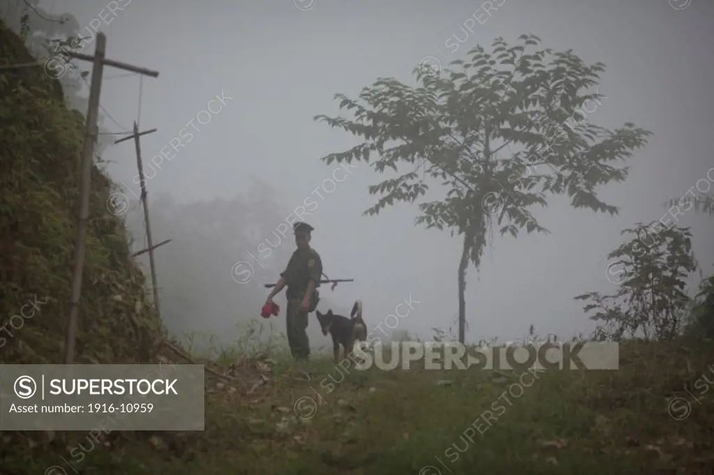 A KIA's soldier check a path which conducts to the Naw Hpyu Post in the front line of the war against the Burma Government, Myanmar on August 2, 2012.