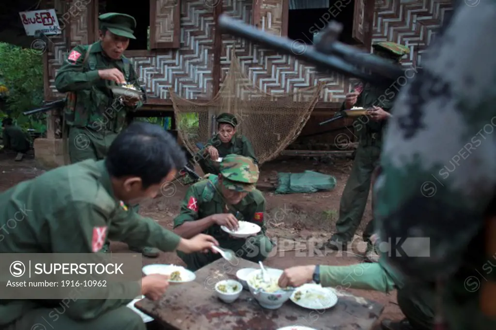 KIA's members take the breakfast in Rubber Hill Post a former Burmese post recover one month ago, Laja Yang village outskirts of Laiza, Kachin State, Myanmar on August 8, 2012.