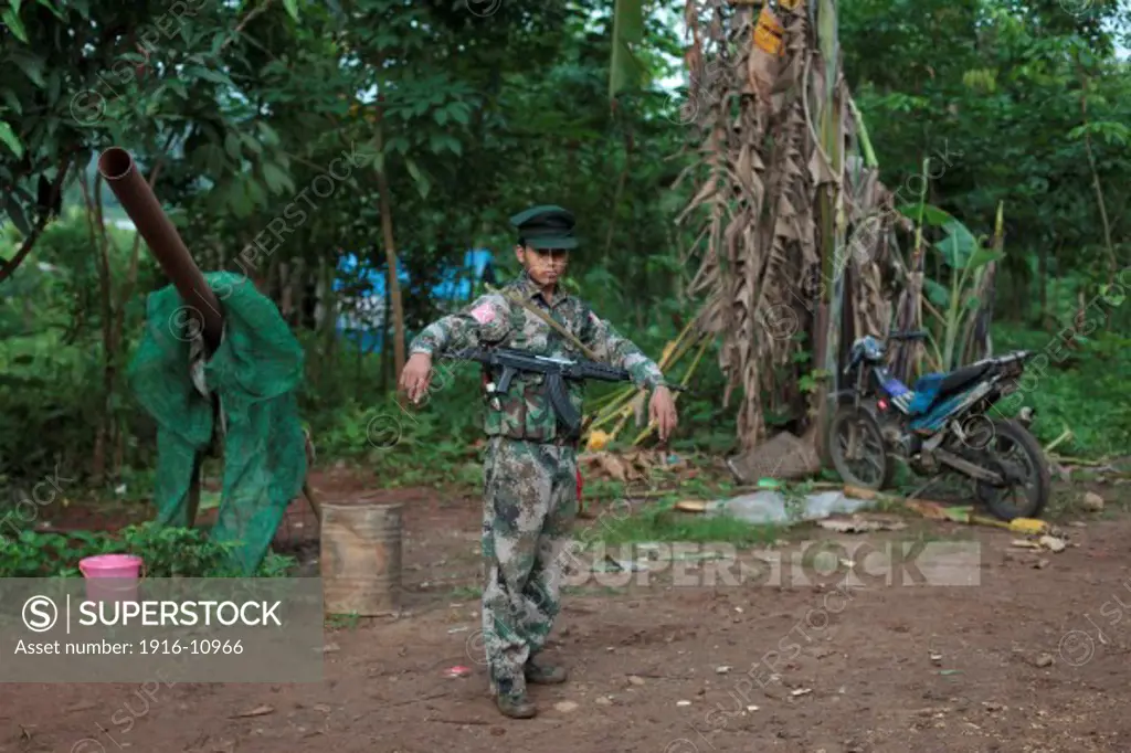 A KIA's soldier is seen in the Rubber Hill Post in the front line of Laja Yang village outskirts of Laiza, Kachin State, Myanmar on August 8, 2012.