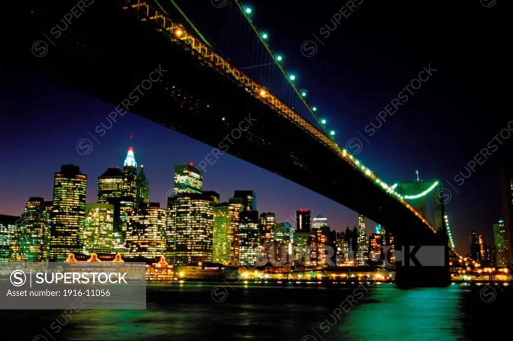 Brooklyn Bridge And Lower Manhattan Skyline At Dusk; New York City, New York, USA