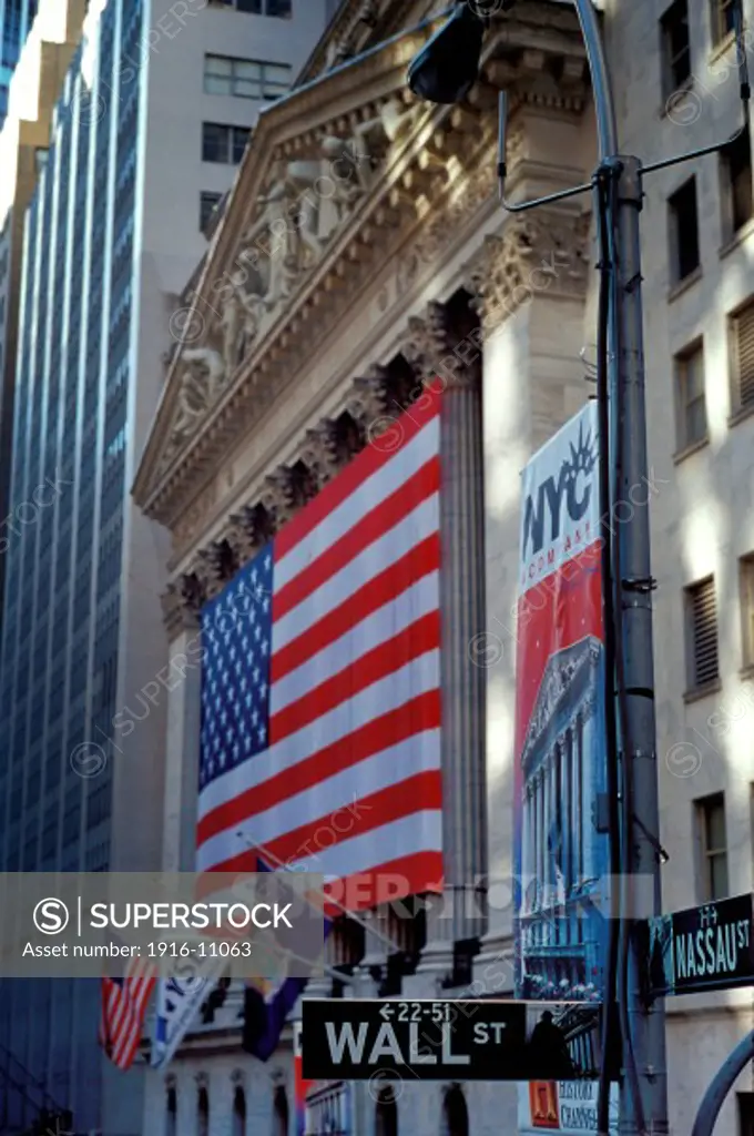 Detail View Of USA Flag Draped New York Stock Exchange Building On Wall Street, New York, NY