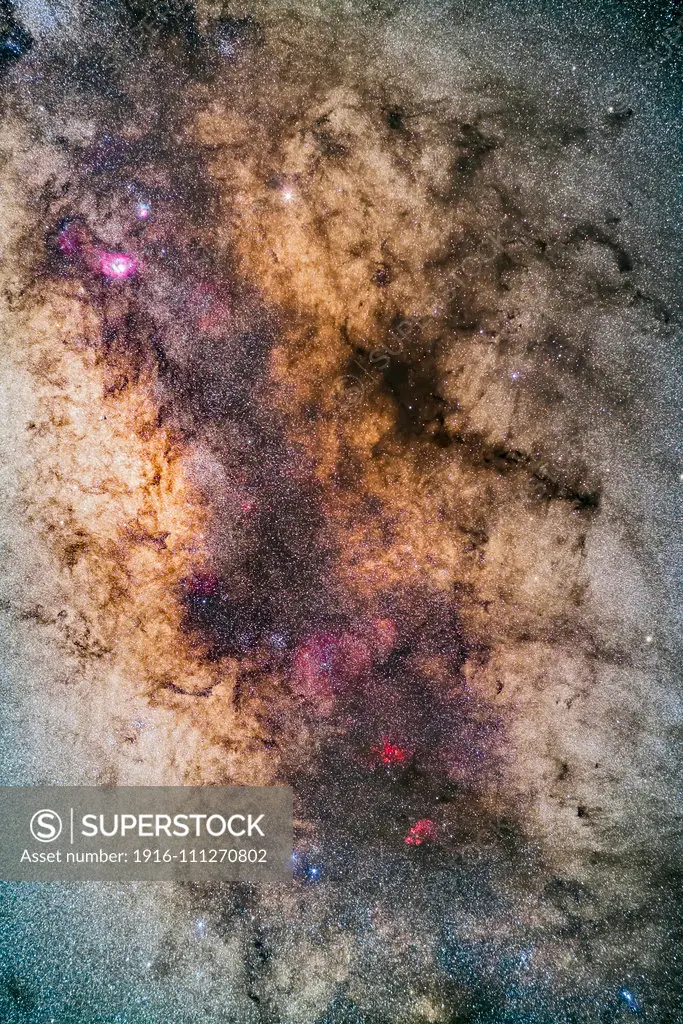 The Milky Way through the region of the tail of Scorpius and up into Sagittarius, photographed with it high in the sky from Australia. At bottom are the red nebulas of NGC 6334, the Cats Paw, and NGC 6357 (sometimes called the Lobster Nebula, for a “Paws and Claws” pairing). The clusters Messier 6 and Messier 7 are at left, below centre, with M7 lost in the star clouds of the Milky Way. The Galactic Centre lies at left centre. The Lagoon and Trifid Nebulas, M8 and M20, are at top left. Satu