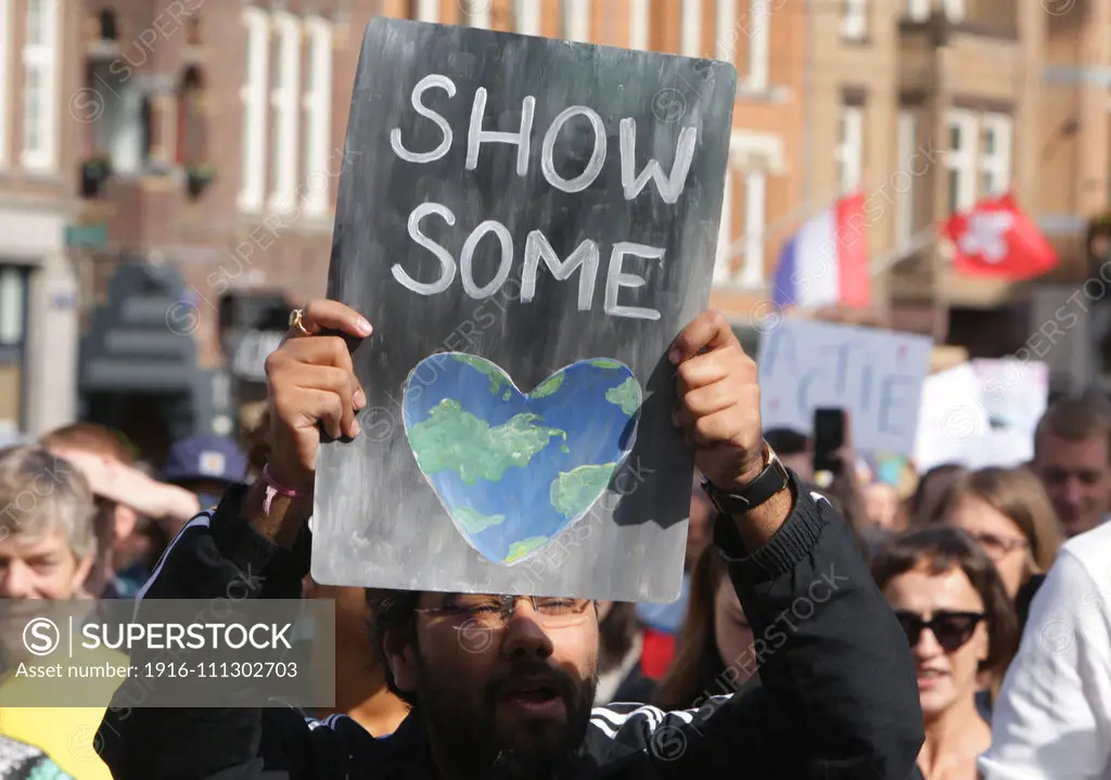 School students and protesters gather during a climate strike demonstration on September 20, 2019 in Amsterdam,Netherlands. Students and supporters joined together on Friday as part of a global mass day of protest to demand action on climate change.