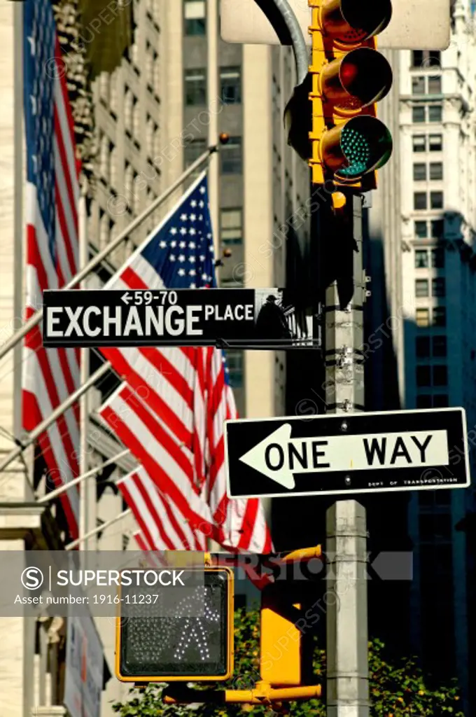 Exchange Place sign and USA flags near the New York Stock Exchange Building on Nassau Street, New York NY