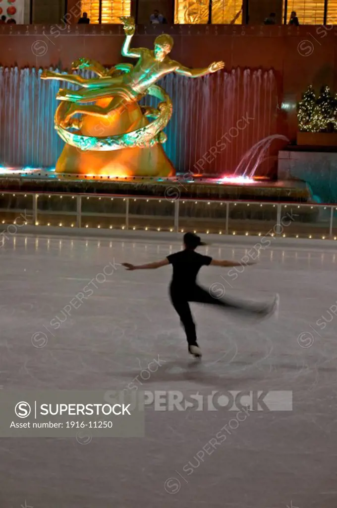 Ice skating on rink at Rockefeller Center, New York NY