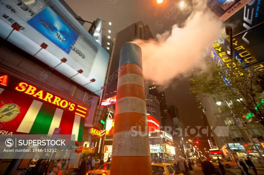 Orange steam vent in street in Times Square at West 49th Street and Broadway, New York, NY