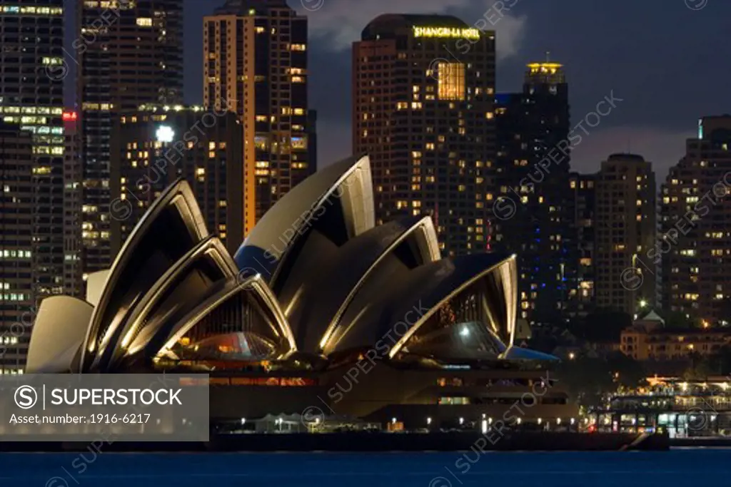 Australia, Sydney, night lit scene looking across Sydney Harbor to iconic Opera House