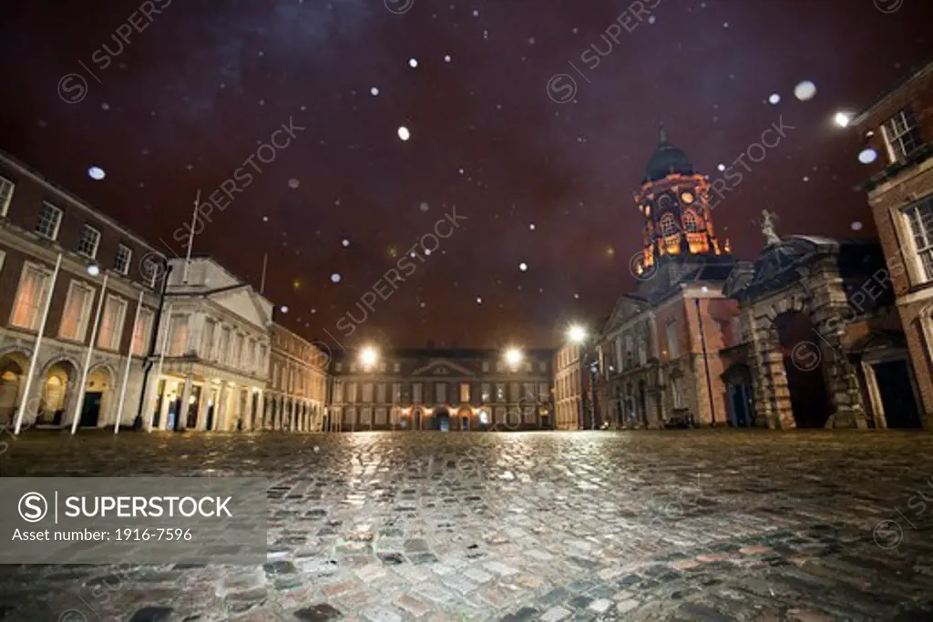 Ireland, Dublin, Dublin Castle, snowing at cobblestone courtyard