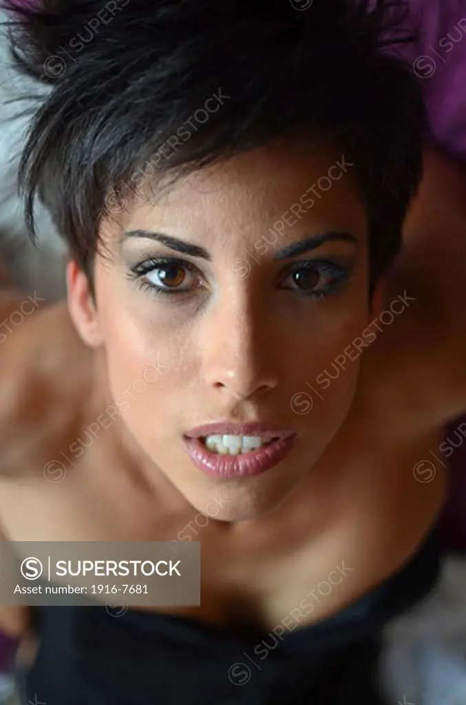 Attractive short haired woman in bed