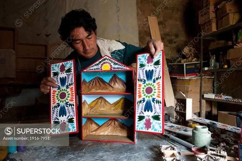 Peru, Ayacucho, handicraft. In the workshop of the Pizarro brothers, mounting the exterior of the 'retablo'