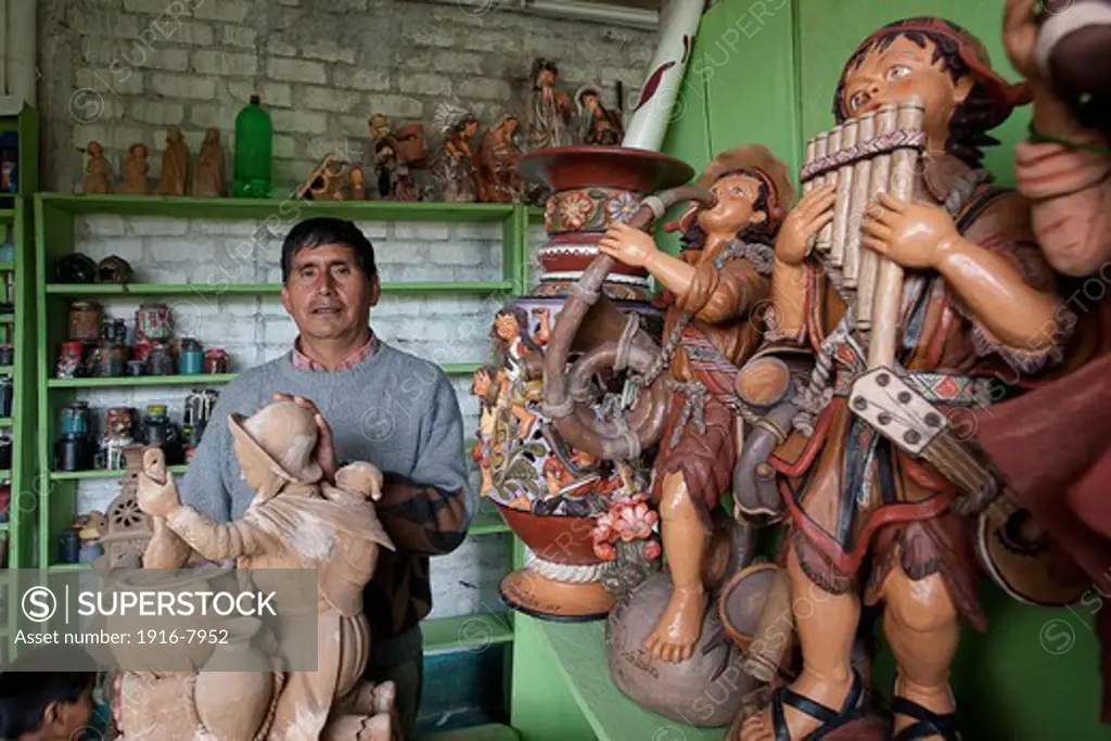 Peru, Ayacucho, handicraft.  Aristides Quispe at work in his laboratory.   Aristides Quispe and his pottery in his workshop.
