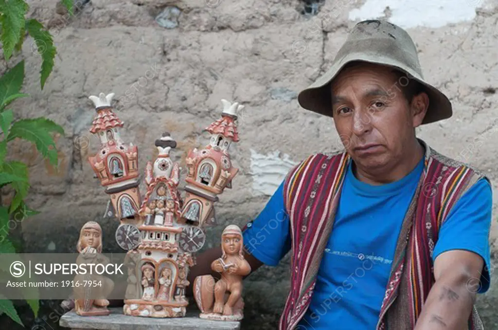 Peru, Ayacucho, Quinoa area, handicraft ..A church of Quinoa pottery and mr. Eloy Yupanqui