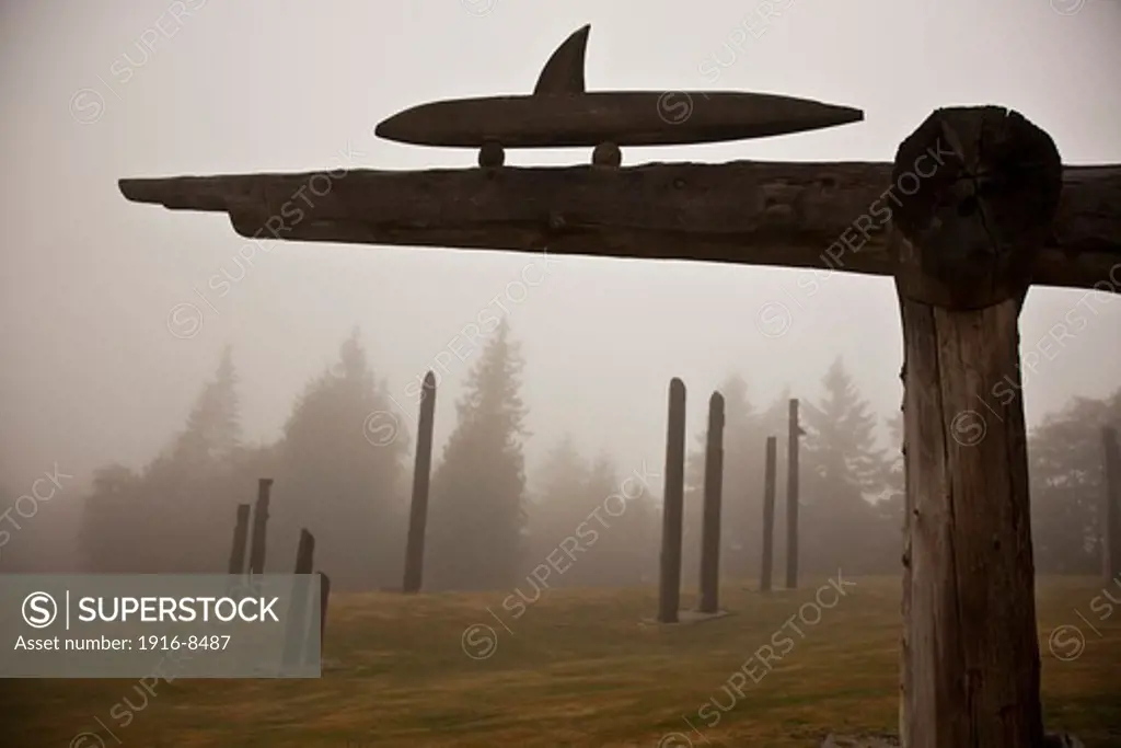 The totem poles on the Burnaby mountain in the fog. Burnaby, British Columbia, Canada.