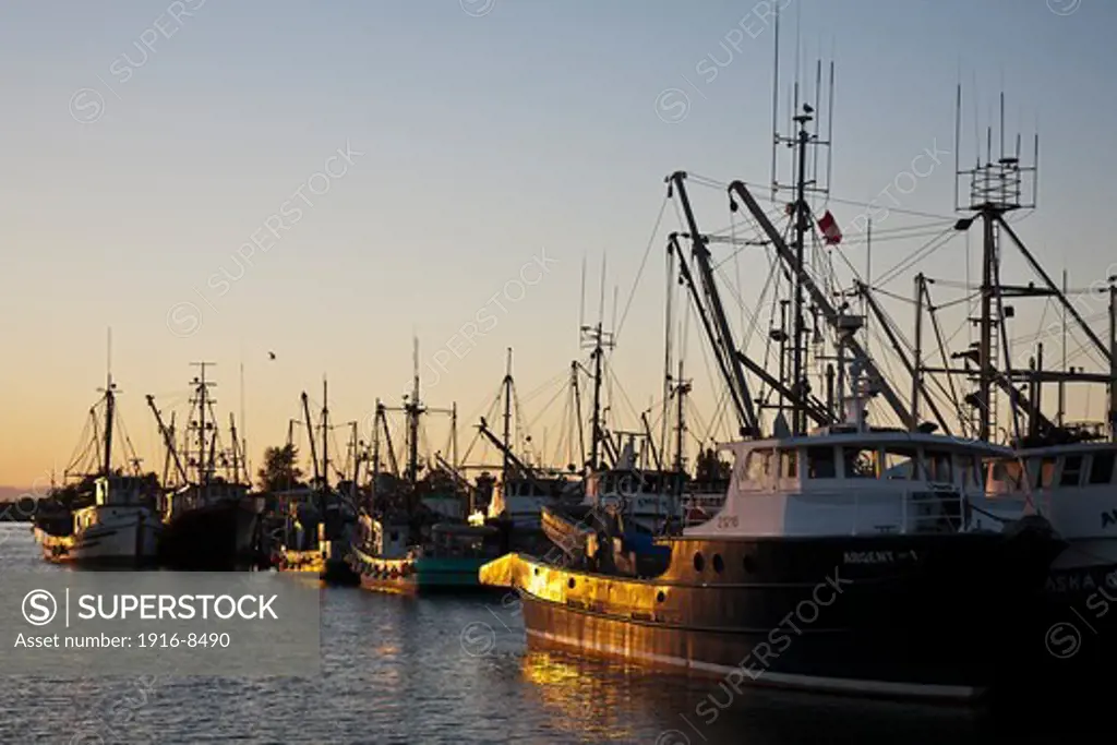 Sunset on the Steveston Village harbour. Steveston village is a historic salmon canning centre at the mouth of the South Arm of the Fraser River, on the southwest tip of Lulu Island in Richmond, British Columbia, Canada.