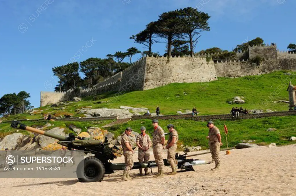 Group of soldiers prepared for a volley of gunfire during an exhibition. Baiona, Galicia, Spain
