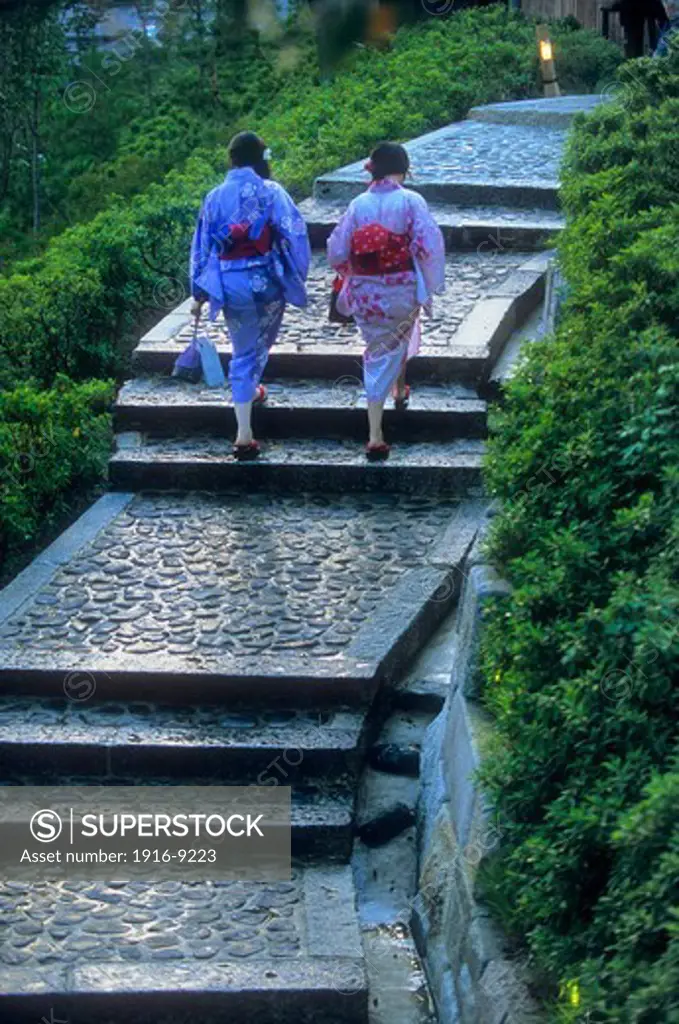 women wearing kimono, they are walking up the stairs to the Ryozen Kannon temple ,Kyoto, Japan