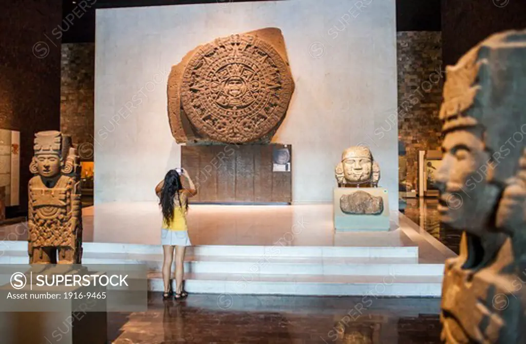 The Aztec Stone of the Sun and other artifacts on display at National Museum of Anthropology, Mexico City, Mexico