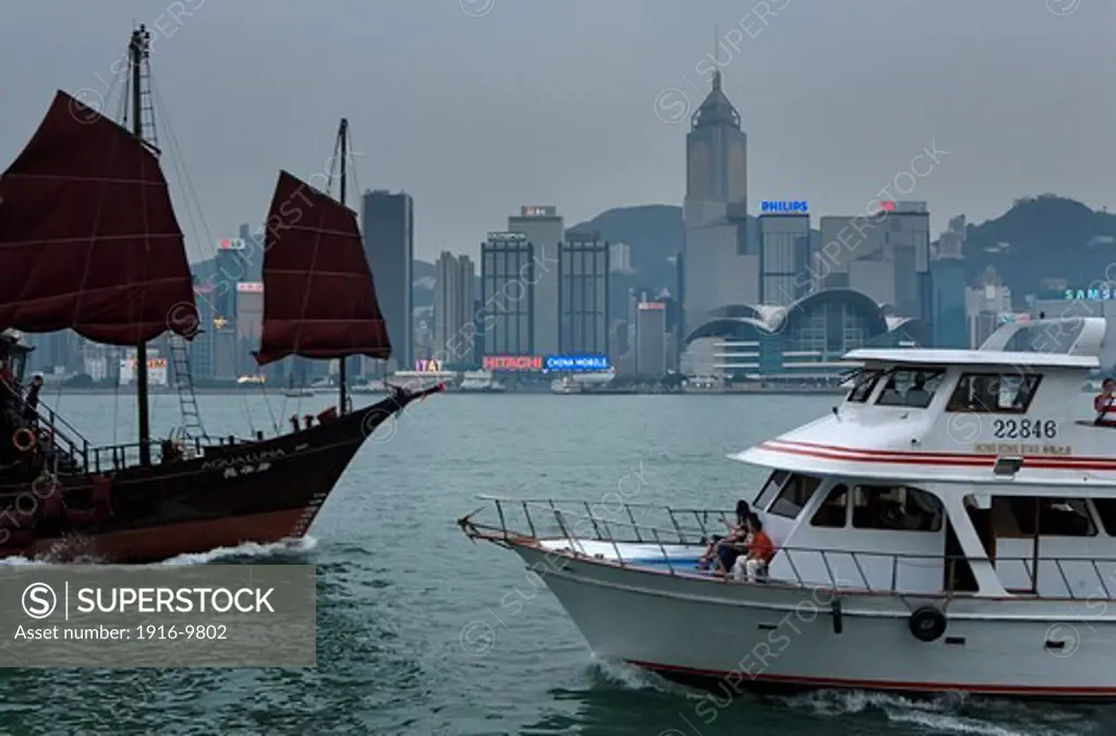 Hong Kong skyline and boats from The Avenue of Stars, Tsim Sha Tsui, Kowloon,Hong Kong, China