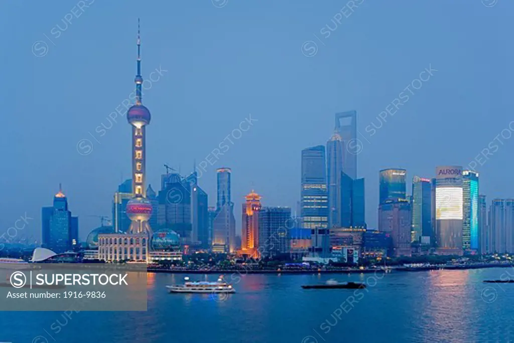 China.Shanghai: Skyscrapers at Pudong. Huangpu River. At left Oriental Pearl Tower. At righ Jin Mao Building and Shanghai World Financial Center (SWFC)