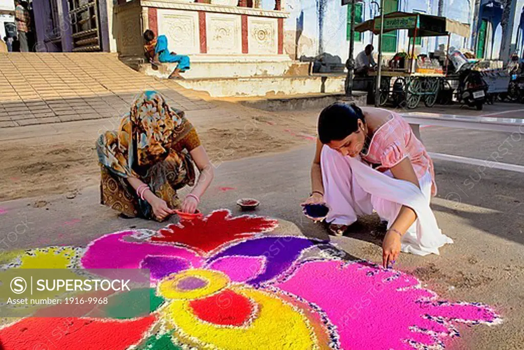 women making rangoli,Gangaur festival,pushkar, Rajasthan, india