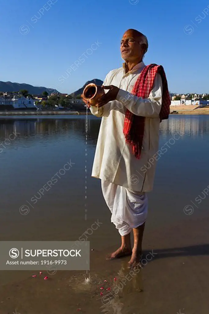 Sadhu praying at the holy lake,pushkar, Rajasthan, india