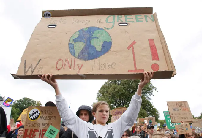 School students and activists gather during a climate strike march on September 27, 2019 in The Hague,Netherlands.  Activists and students  joined together in The Hague against the Dutch governments lack of action in the face of the climate crisis. According to Fridays for Future Nederland, 'The current climate agreement is not enough and its not in accordance with the Urgenda verdict, demand a Dutch Green New Deal with fair and ambitious climate policy to tackle the climate crisis effectively