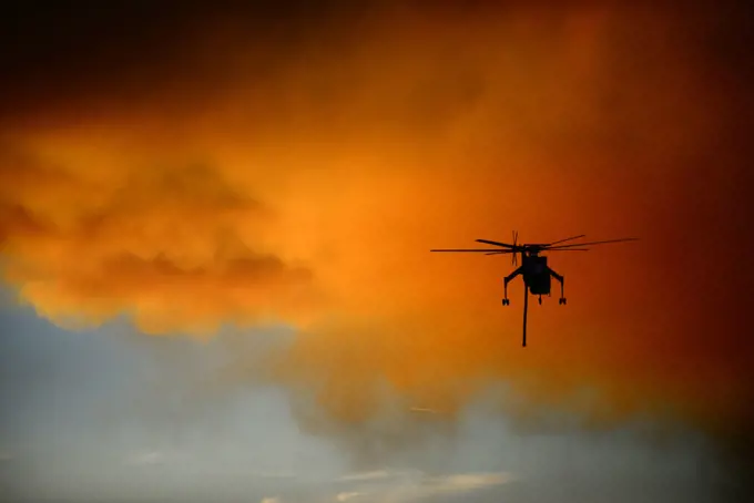 Helicopter fighting wildfire in Yosemite area, California, United Staes
