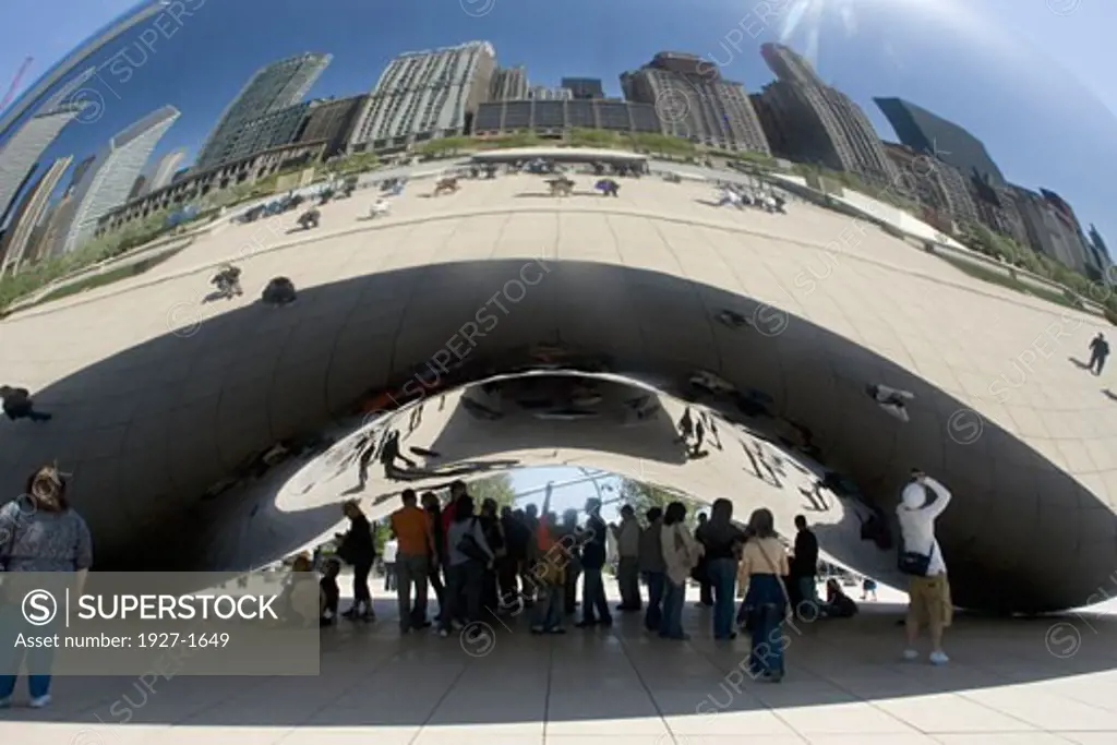 Cloud Gate sclupture by Anish Kapoor in Millennium Park provides a distorted reflection of the Chicago skyline  Chicago  Illinois